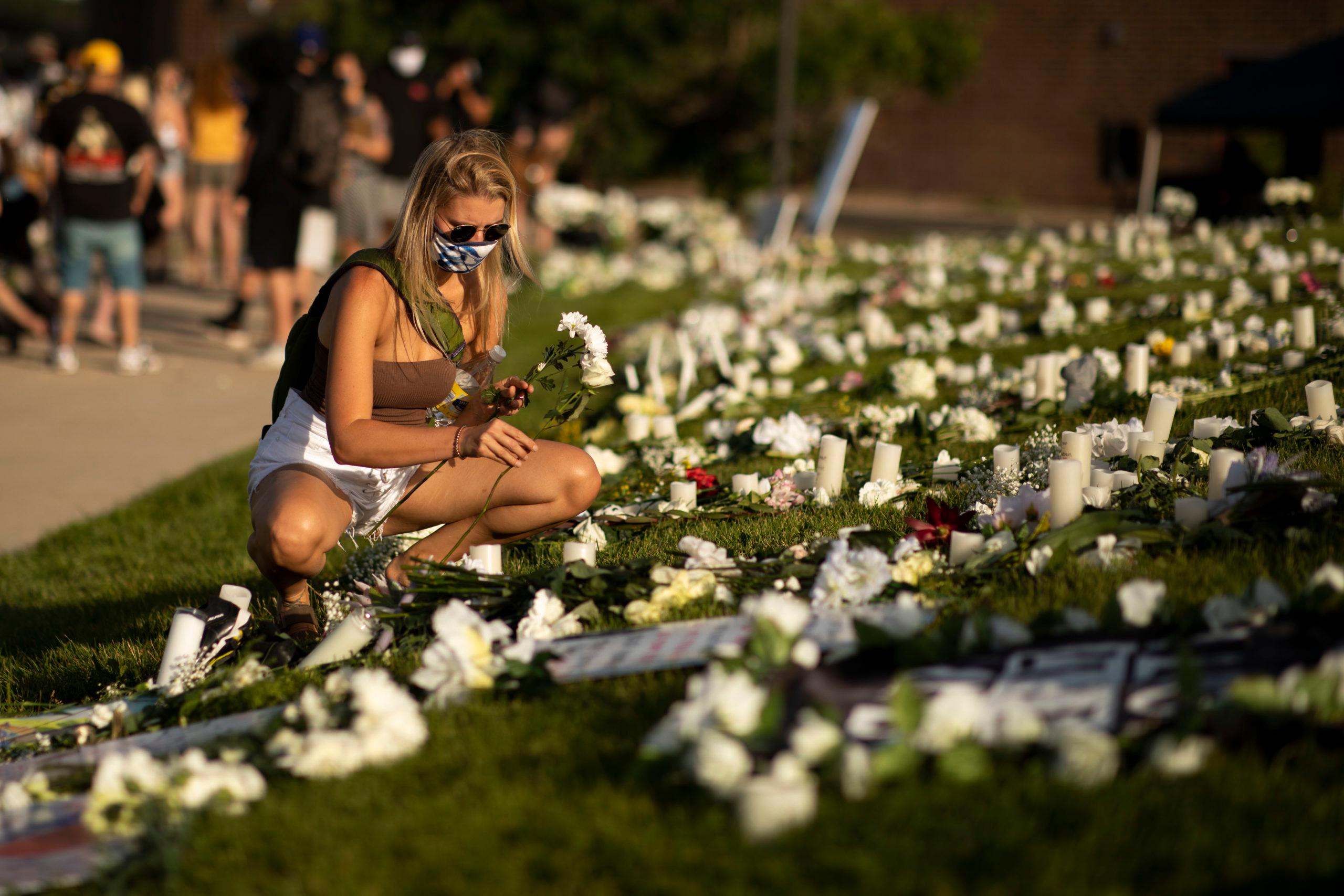 Flowers placed for Elijah McClain during a vigil in Aurora on July 11, 2020