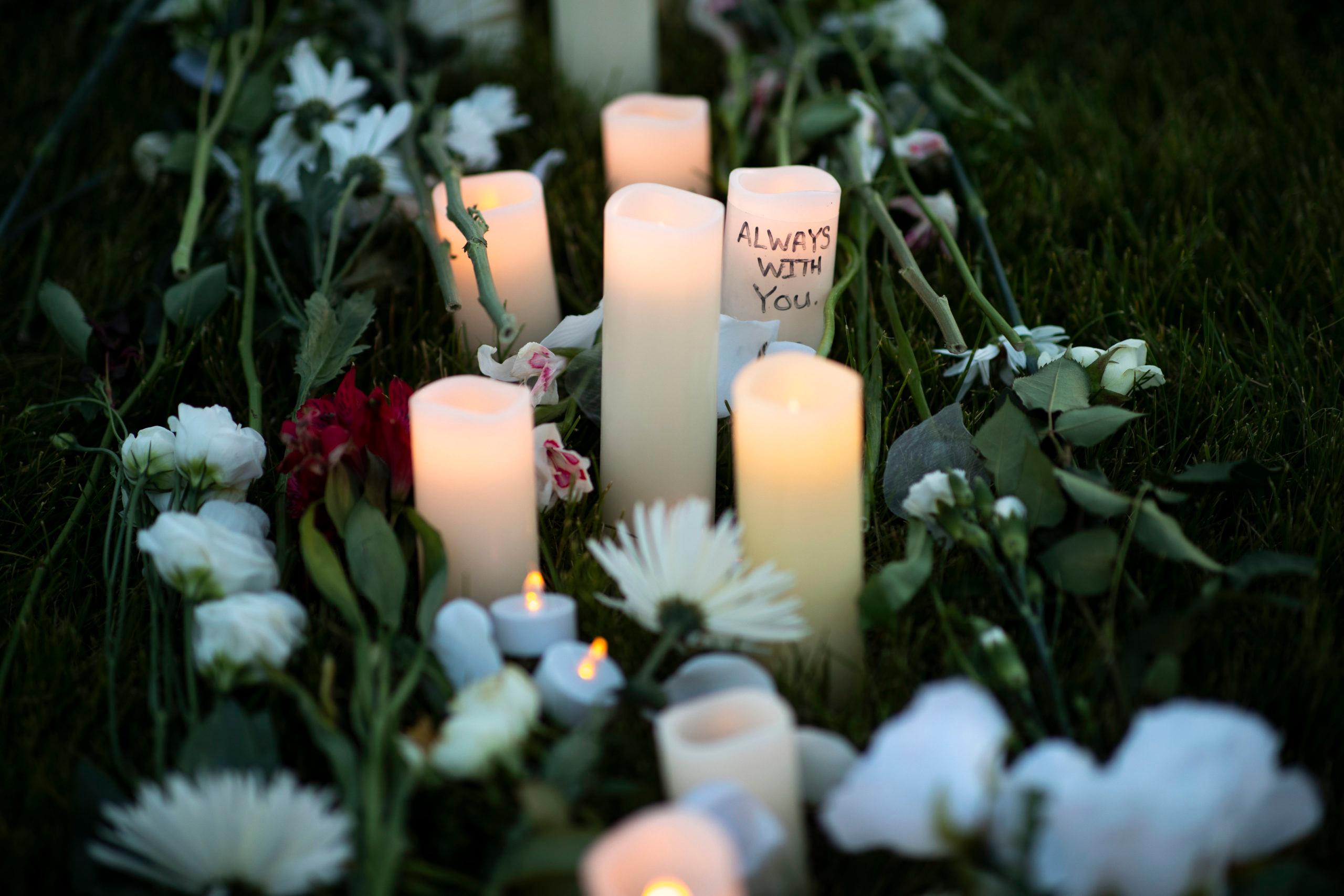 Candles and flowers for Elijah McClain Vigil