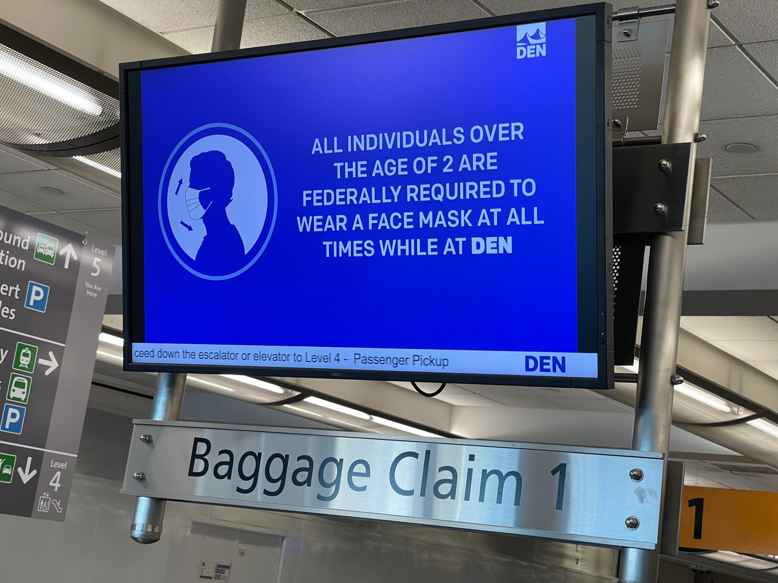 A sign announced face masks are required at Denver International Airport, still up after a federal judge struck down the Centers for Disease Control and Prevention mask mandate on April 18, 2022.