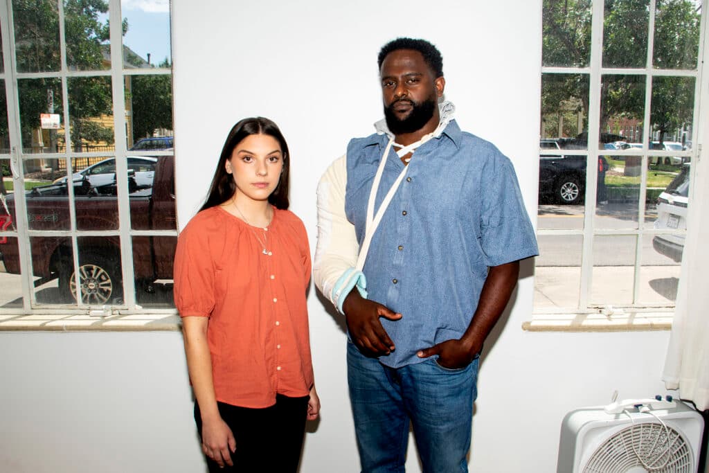 Bailey Alexander (left) and Yekalo Weldehiwet sit in the Rathod Mohamedbhai law office in Denver's Five Points neighborhood. July 20, 2022.