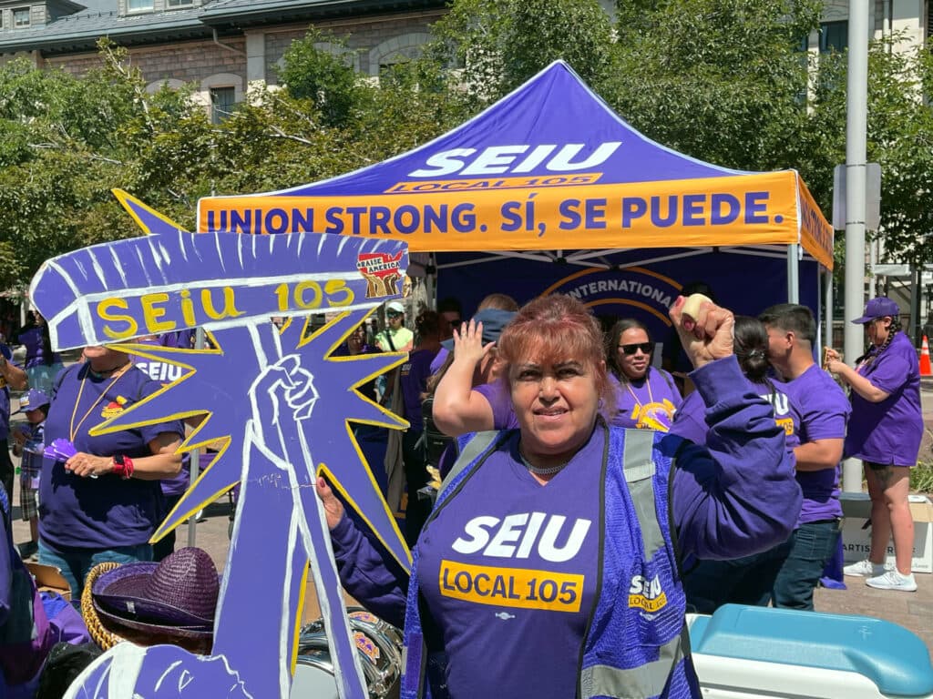 Maria Hernandez, a Denver janitor, participates in an SEIU Local 105 rally outside Union Station, on June 17, 2024.