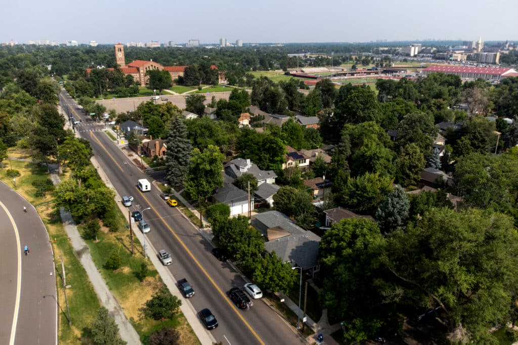 An aerial view of South High School, surrounded by a tree-covered neighborhood.