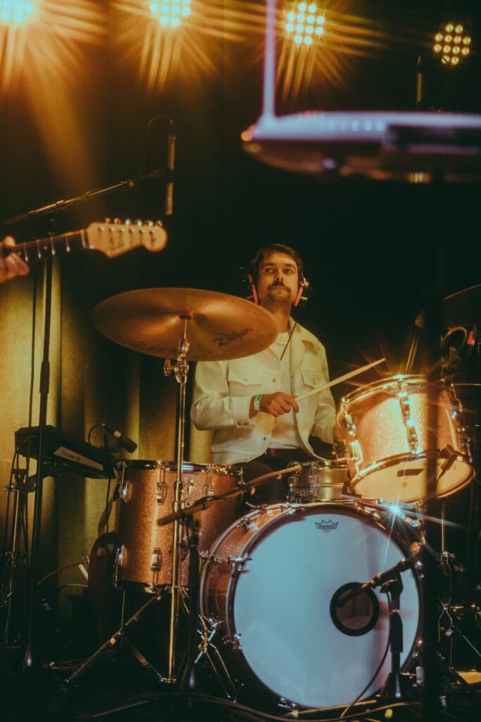 Forrest Raup playing drums at the Grace DeVine EP release show at Globe Hall on Sept. 15, 2023.