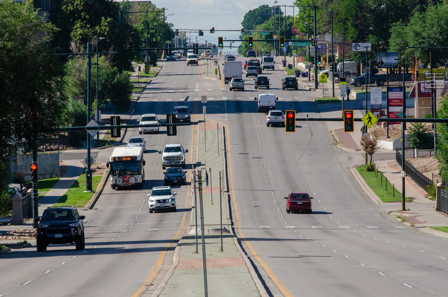 Traffic moves along South Federal Boulevard in Denver on Monday, Aug. 12, 2024.