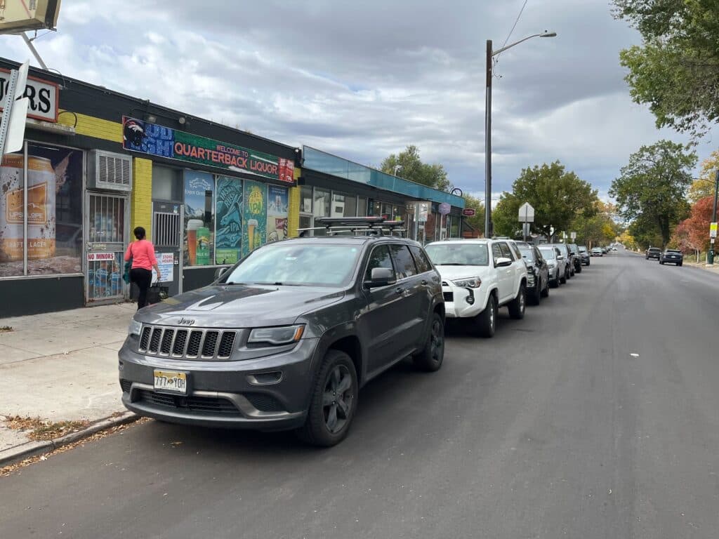 On-street parking spots were full in front of a row of shops at West 29th Avenue