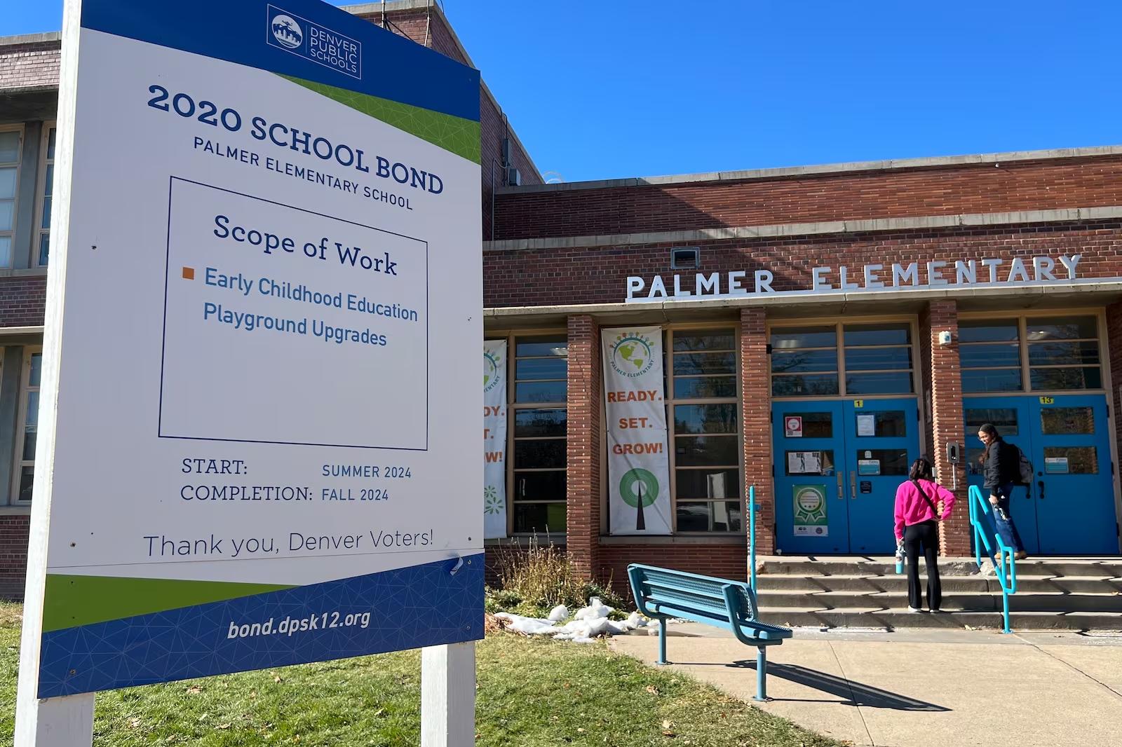 A sign outside Palmer Elementary details construction projects paid for by a bond measure approved by Denver voters