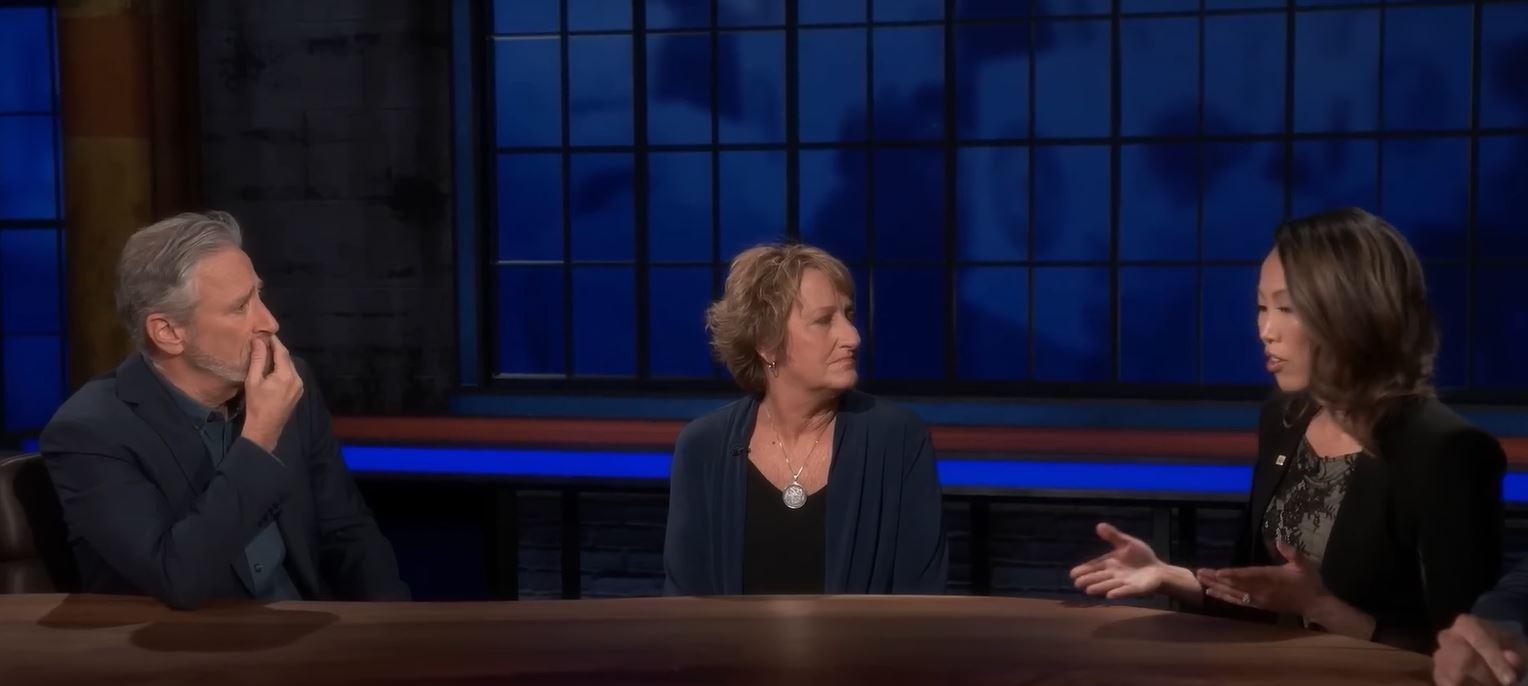 Jon Stewart speaks with two women who are elections officials.