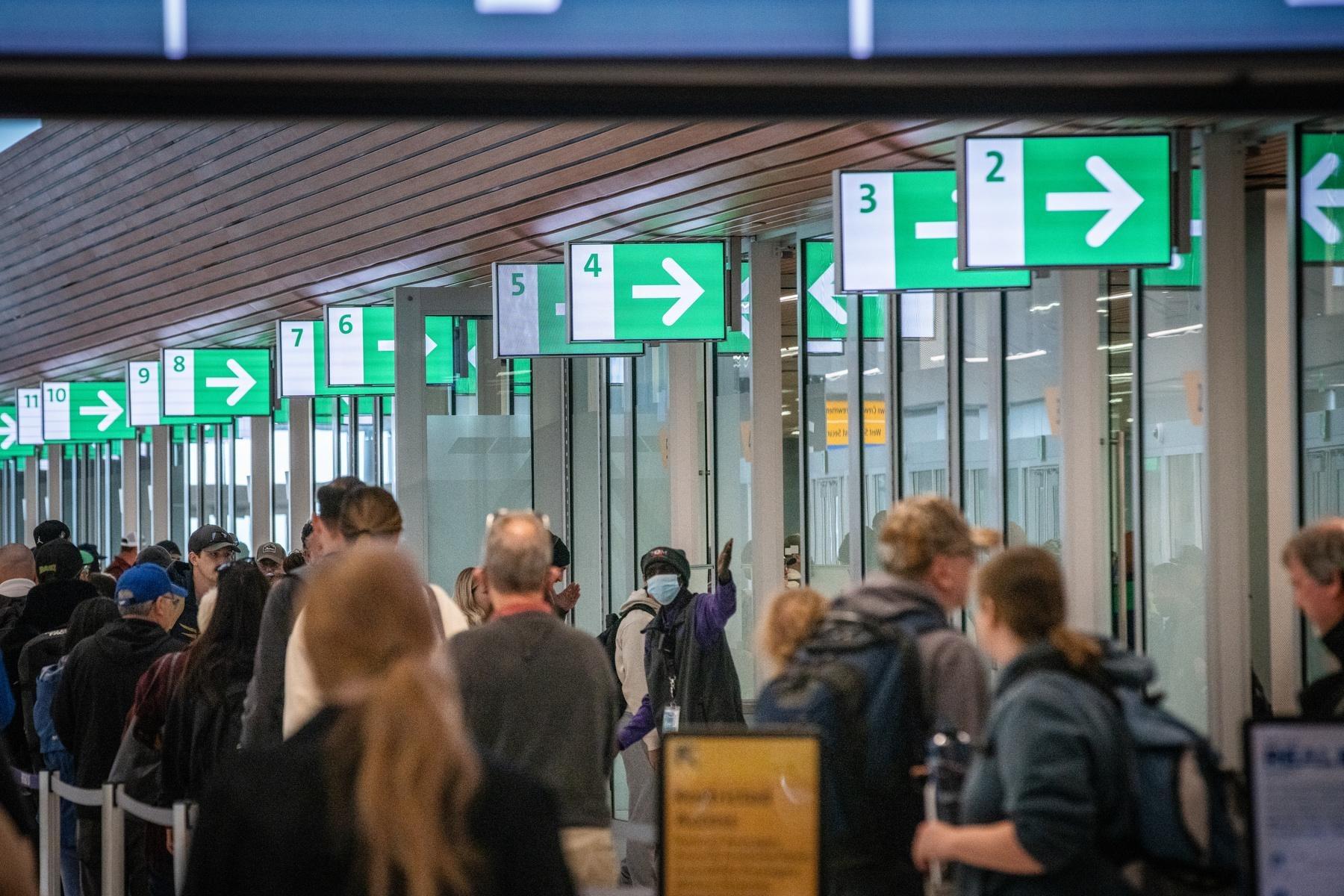 Passengers head into the West Security Checkpoint